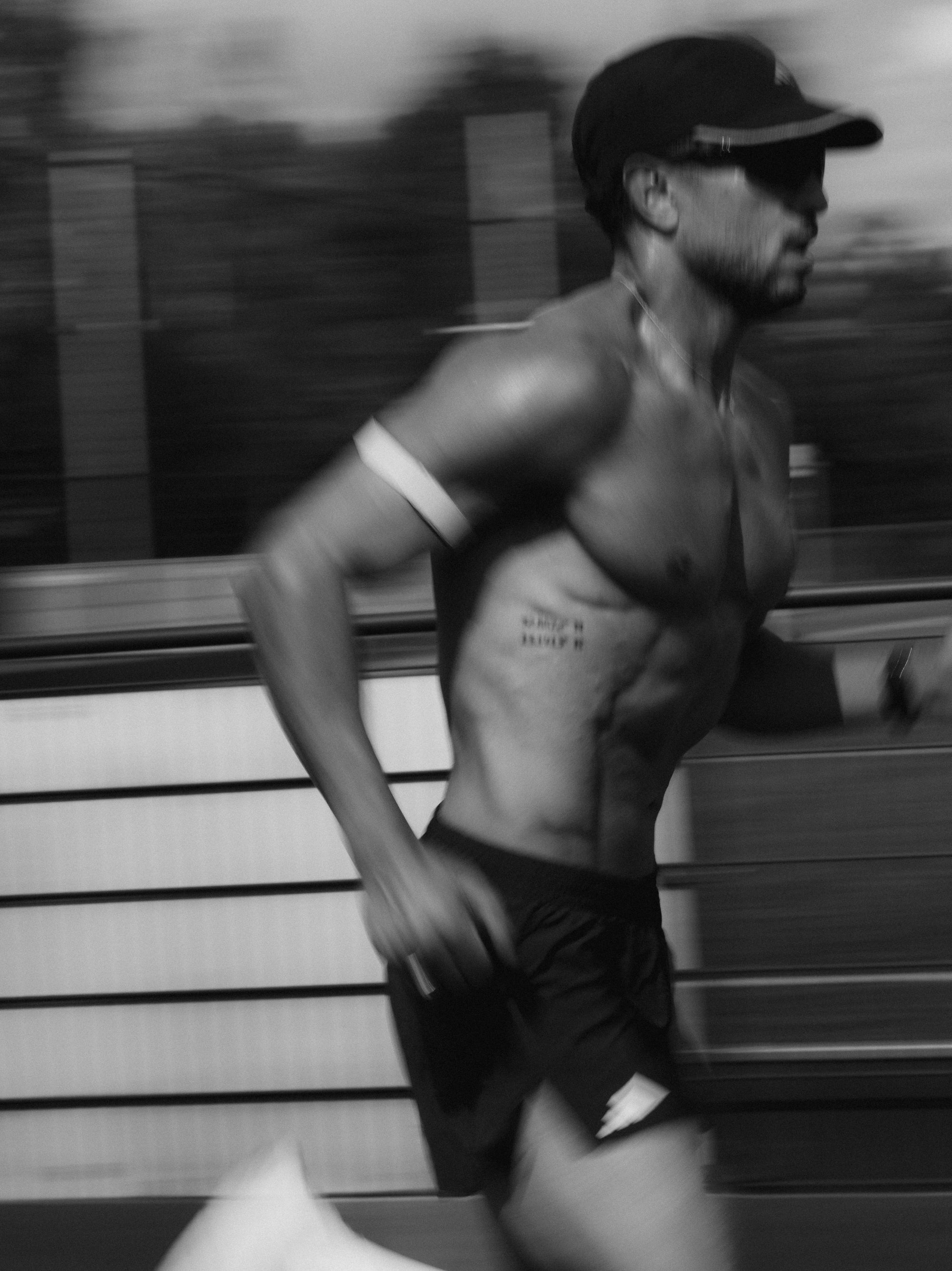 Man running on a track with blurred background